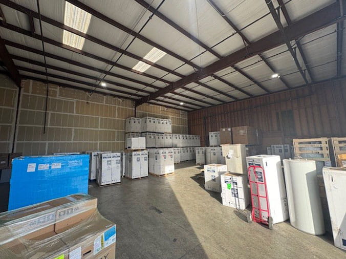 Boxed water heaters in the Visalia Pipe & Supply plumbing warehouse